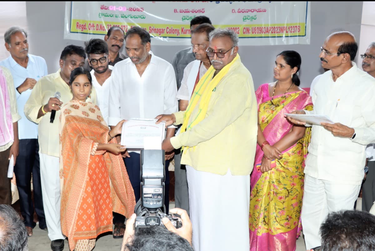 Student with parents receiving certificate at 2025 ceremony