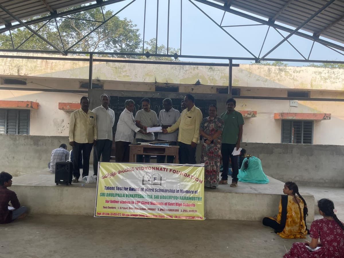 Certificate distribution at outdoor stage with Vidyonnati Foundation banner
