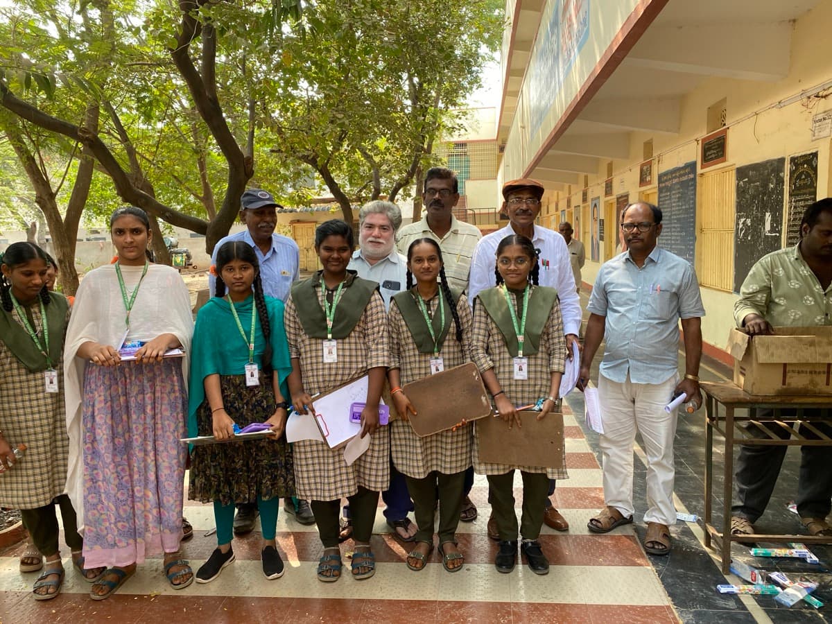Students and volunteers at school campus
